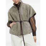 Woman wearing Brunello Cucinelli Curly Shearling Short Sleeve Outerwear with Shiny Zipper Pull, featuring zip fastening and nickel-free monili.
