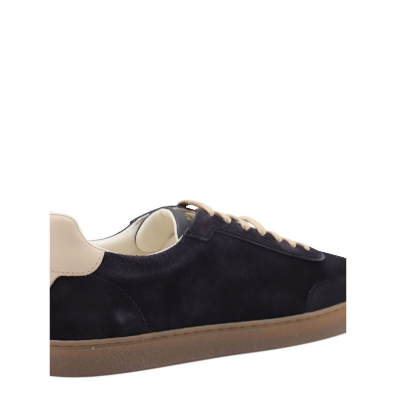 Brunello Cucinelli Suede sneakers in dark blue with leather detail, flat laces, round toe, and rubber sole.