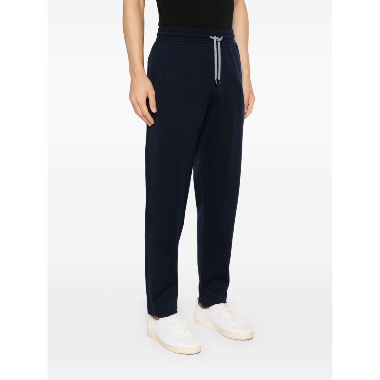Brunello Cucinelli Trousers Blue with elastic waistband, tapered leg, drawstring, and pockets, shown on model.