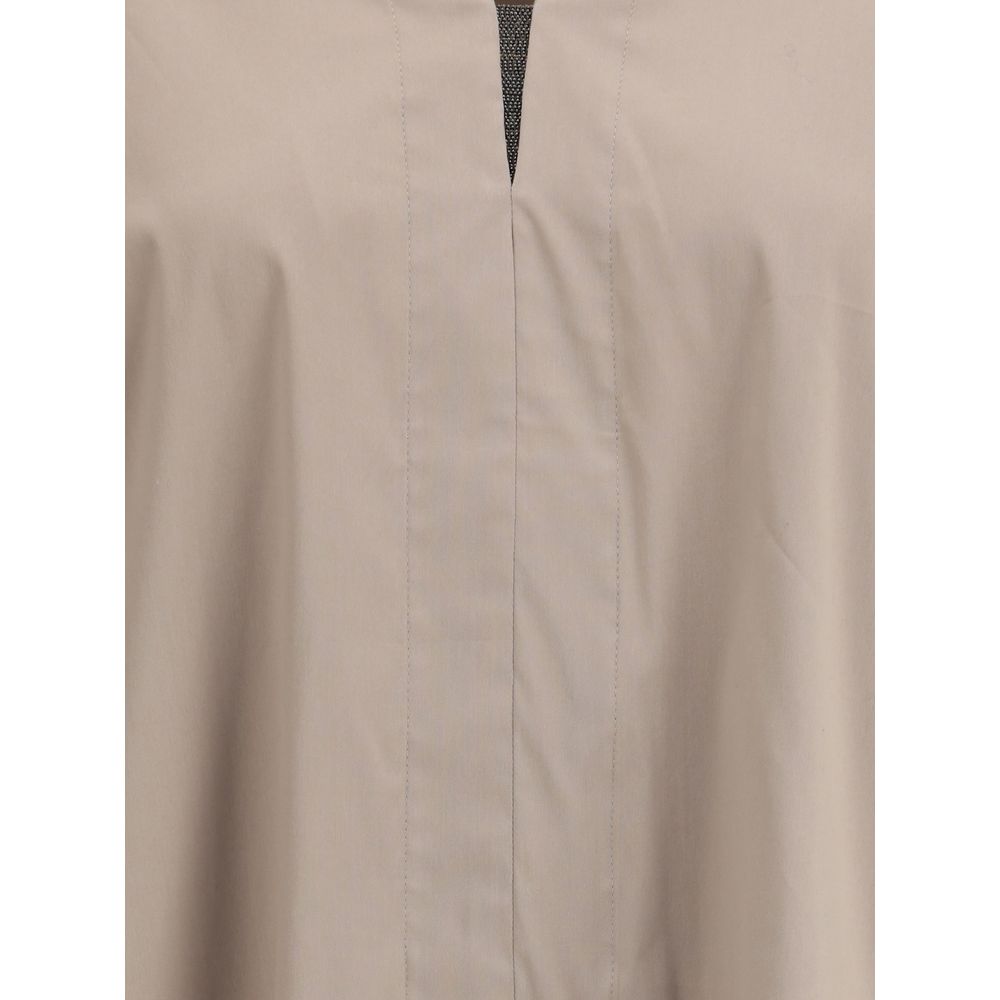Close-up of Brunello Cucinelli Wide Shirt with V-neck and jewel embellishments, showcasing elegant and airy design.
