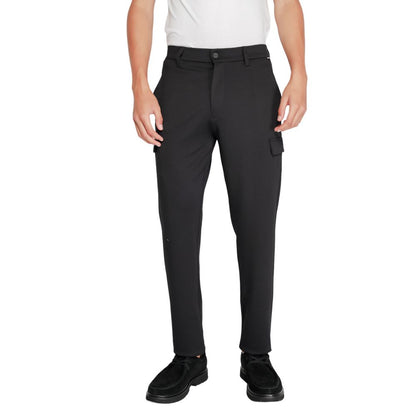 Calvin Klein Black Recycled Polyester Joggers (Workout Pants) shown worn by a model, highlighting the tapered fit and sustainable material blend.