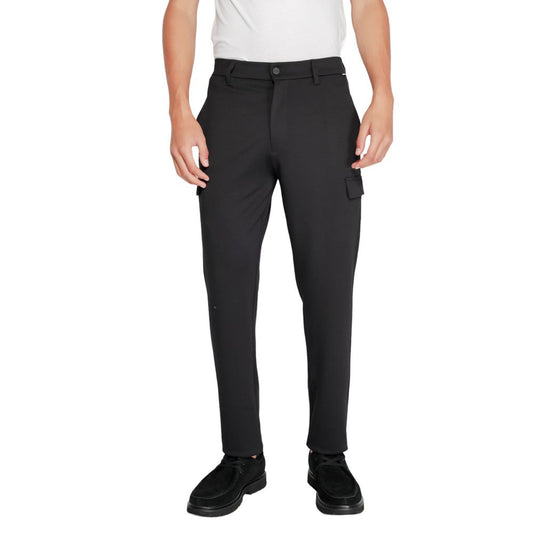 Calvin Klein Black Recycled Polyester Joggers (Workout Pants) shown worn by a model, highlighting the tapered fit and sustainable material blend.