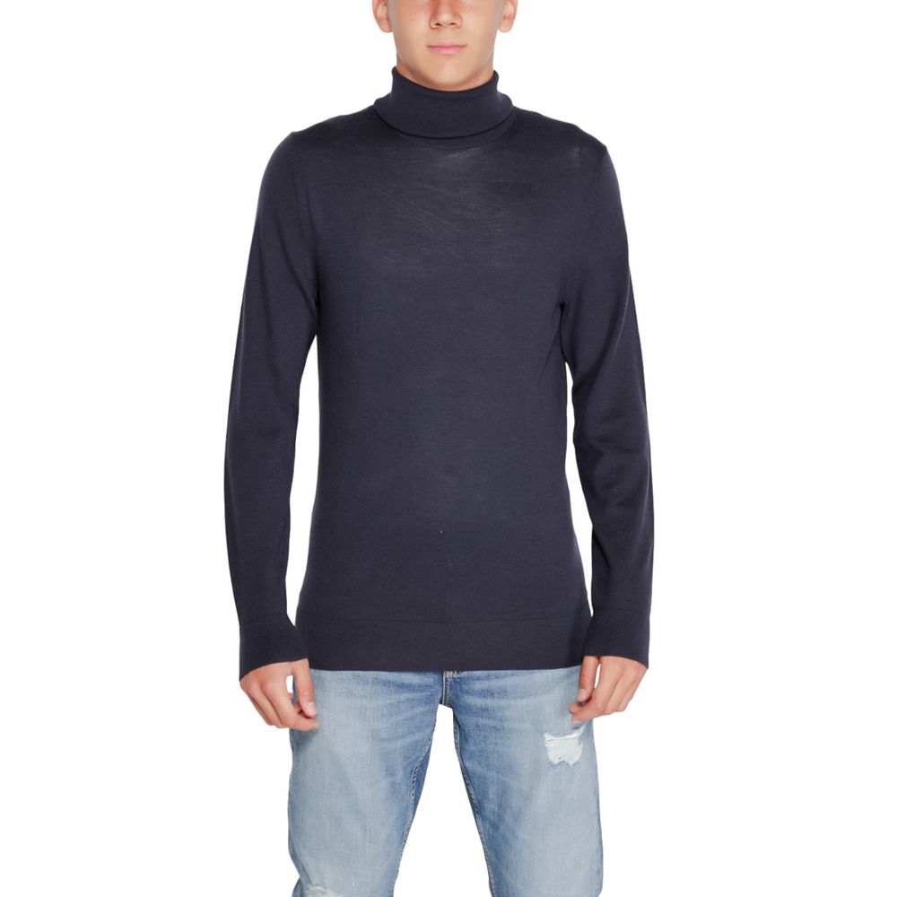 Calvin Klein Blue Wool Turtleneck worn by a model, showcasing its elegant and refined design suitable for winter wardrobe essentials.