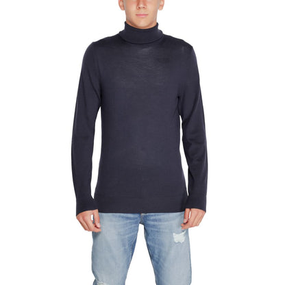 Calvin Klein Blue Wool Turtleneck worn by a model, showcasing its elegant and refined design suitable for winter wardrobe essentials.