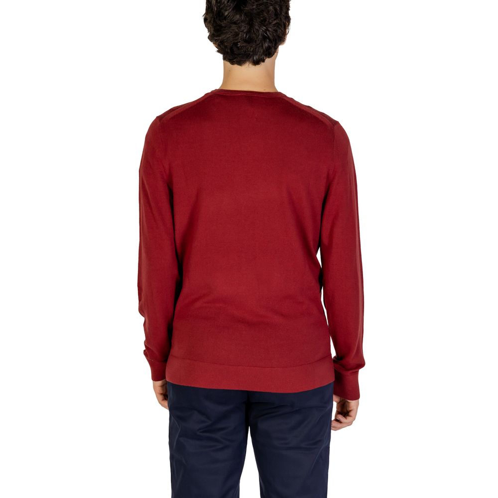 Back view of Calvin Klein Bordeaux Recycled Wool Sweatshirt on model showcasing crew neck and ribbed finishes.