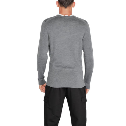 Back view of man wearing Calvin Klein Gray Recycled Wool Sweatshirt, showcasing classic design and sustainable materials.