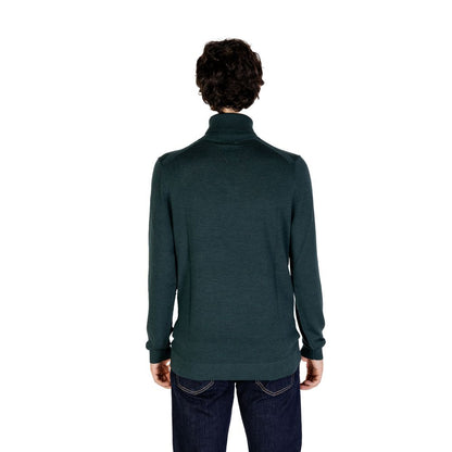 Back view of Calvin Klein Green Wool Turtleneck on model, showcasing premium Merino wool and refined design for winter wear