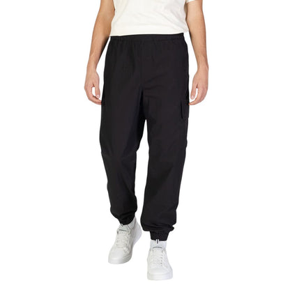 Calvin Klein Jeans Black Cotton Joggers (Workout Pants) with elastic waistband for comfort and utility pockets for essentials.