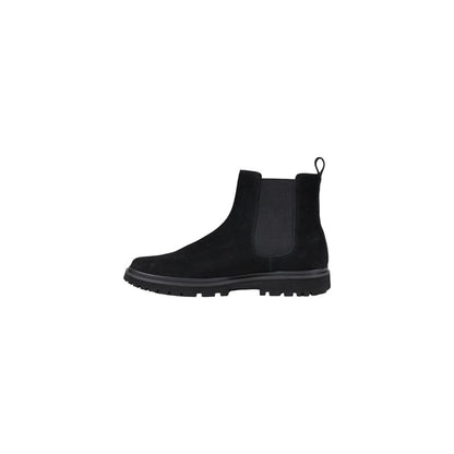 Calvin Klein Jeans Black Suede Leather Chelsea Boots with side elastic inserts and pull tab for easy wear, showcasing modern elegance and durability.