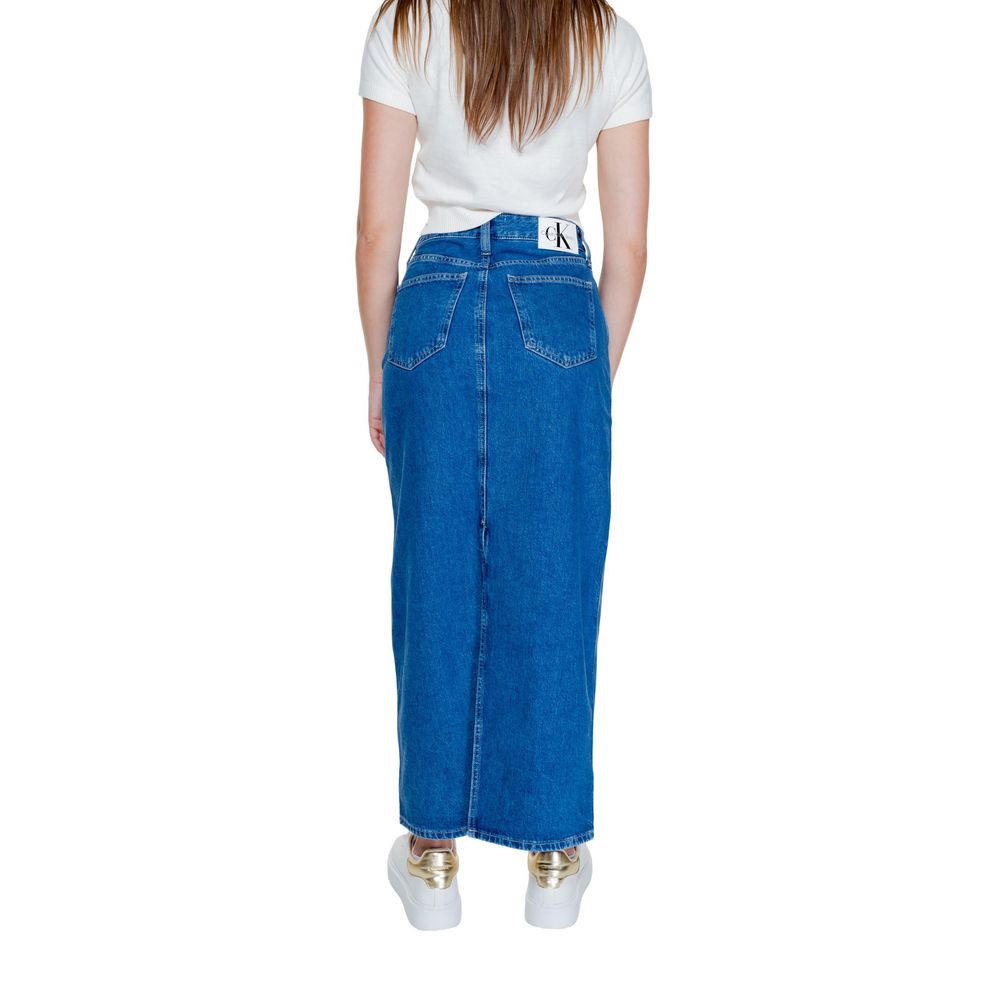 Back view of Calvin Klein Jeans Blue Cotton Long Skirt on model, high-waisted denim with contrast stitching and front pockets, sustainable design.