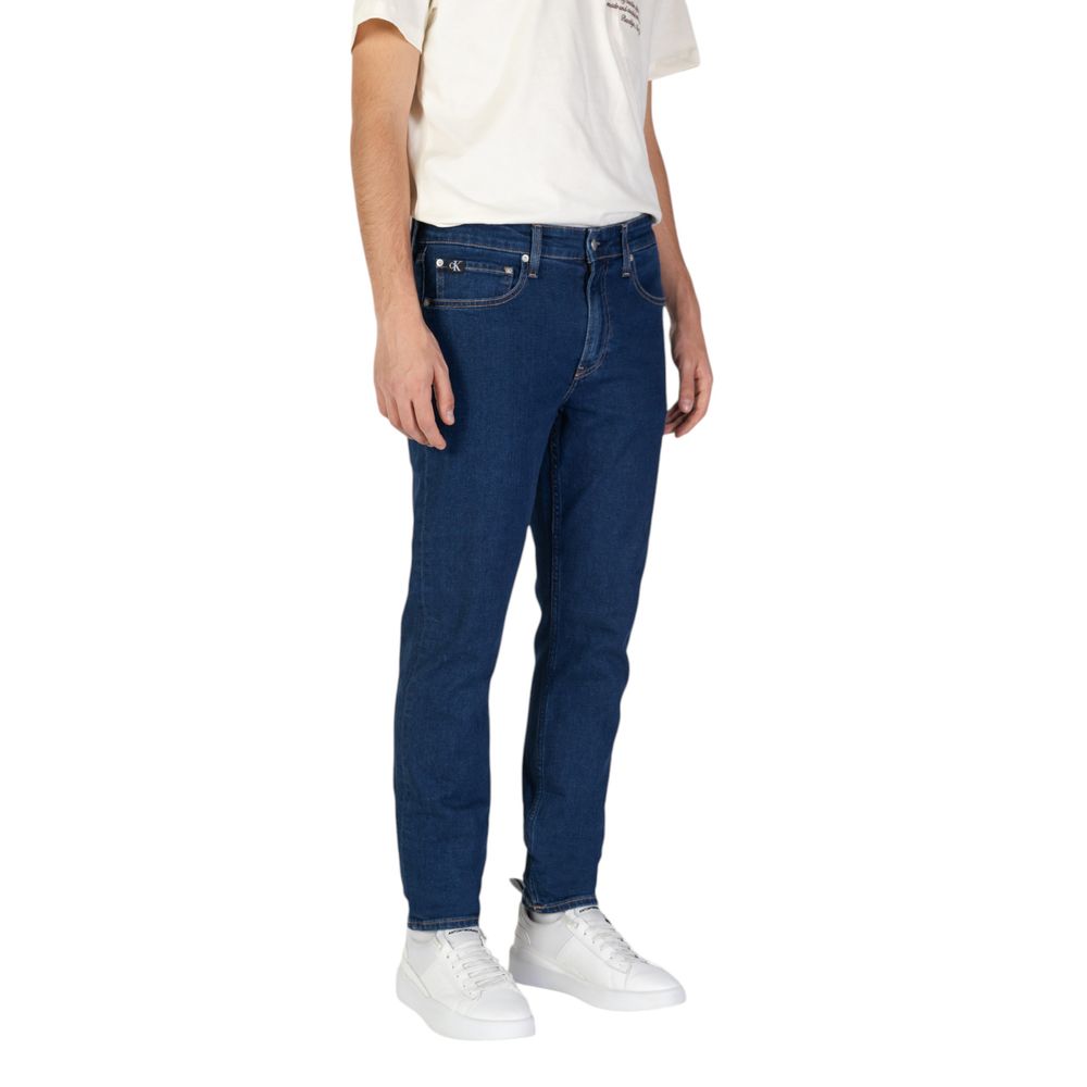 Calvin Klein Jeans Blue Cotton Slim Fit Jeans worn by model, showcasing sleek tapered fit and sustainability.