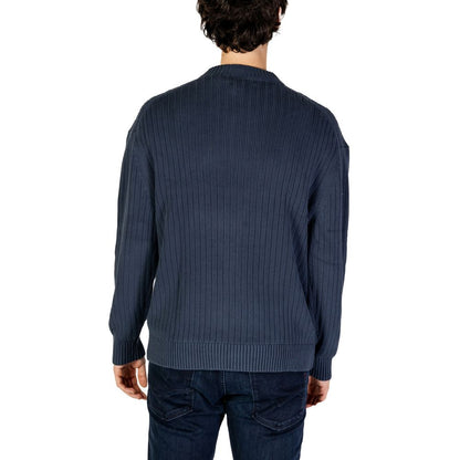 Back view of Calvin Klein Jeans Blue Cotton Sweatshirt with ribbed texture and crew neck design.