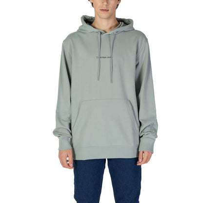Calvin Klein Jeans Green Cotton Hoodie with logo for men, stylish and comfortable, worn casually. Essential urban fashion garment.