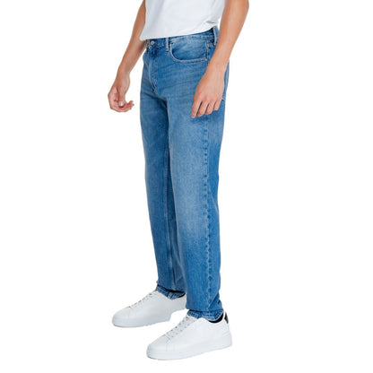 Model wearing Calvin Klein Jeans Light Blue Cotton Relaxed Fit Jeans showcasing straight, loose fit with sustainable materials.