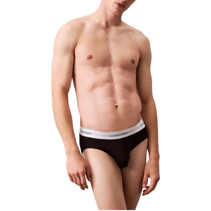 Model wearing Calvin Klein Underwear Gray Cotton Briefs showcasing comfort and style with branded waistband.