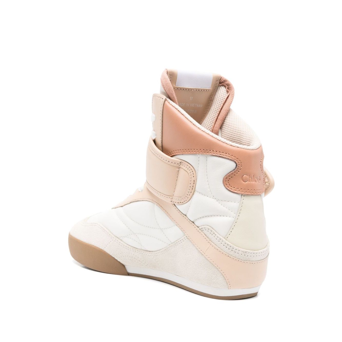 Alt Tag: Light beige Chloé Chloè Kick leather sneakers with touch-strap and logo patch on round toe, featuring rubber sole and 0.6-inch heel.