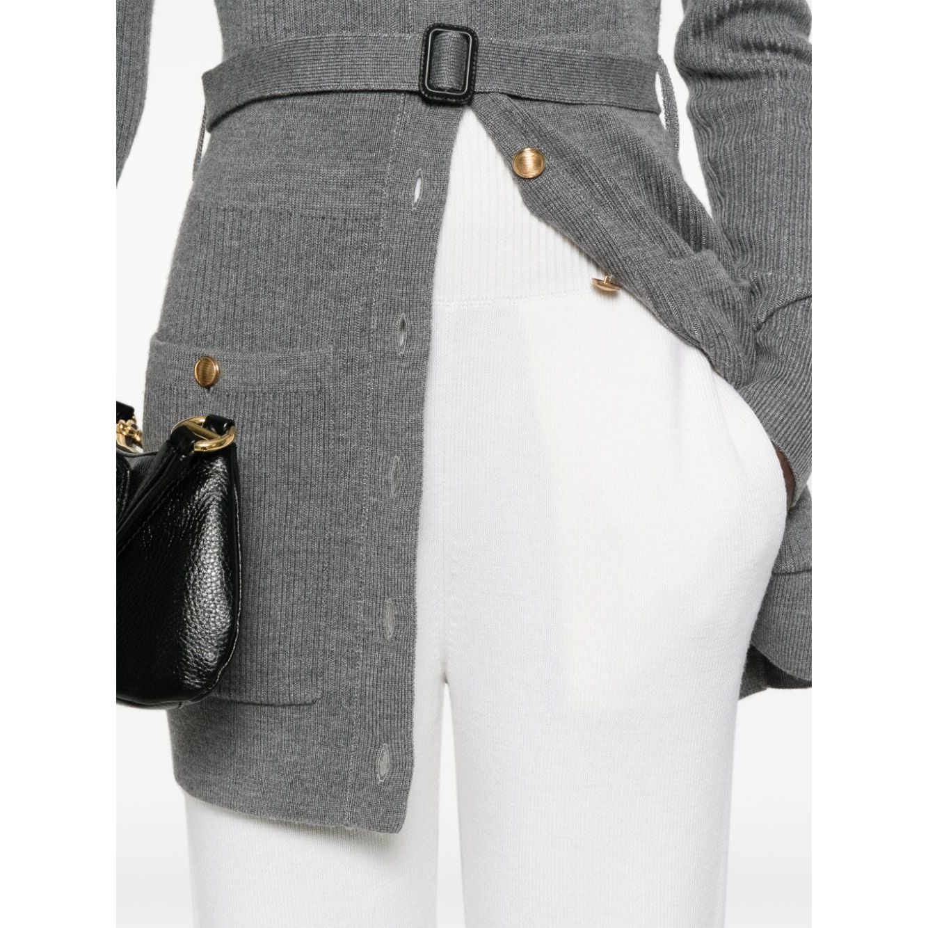 Model wearing Chloé Chloè Trousers White with high-waisted elasticated ribbed waistband and tapered leg, featuring side inset pockets.