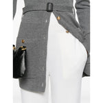 Model wearing Chloé Chloè Trousers White with high-waisted elasticated ribbed waistband and tapered leg, featuring side inset pockets.