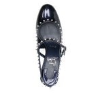 Christian Louboutin Janispikes pumps in dark blue patent leather with studded embellishments and slingback strap.