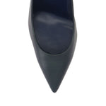 Close-up of Christian Louboutin Kate 100 mm Pumps - Nappa leather in blue lambskin with pointed toe and red sole.