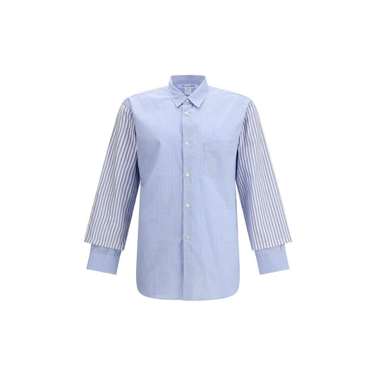 Comme Des Garçons Light Blue Cotton Pattern Shirt with subtle stripes and double cuffs, avant-garde design with a modern, elegant style.