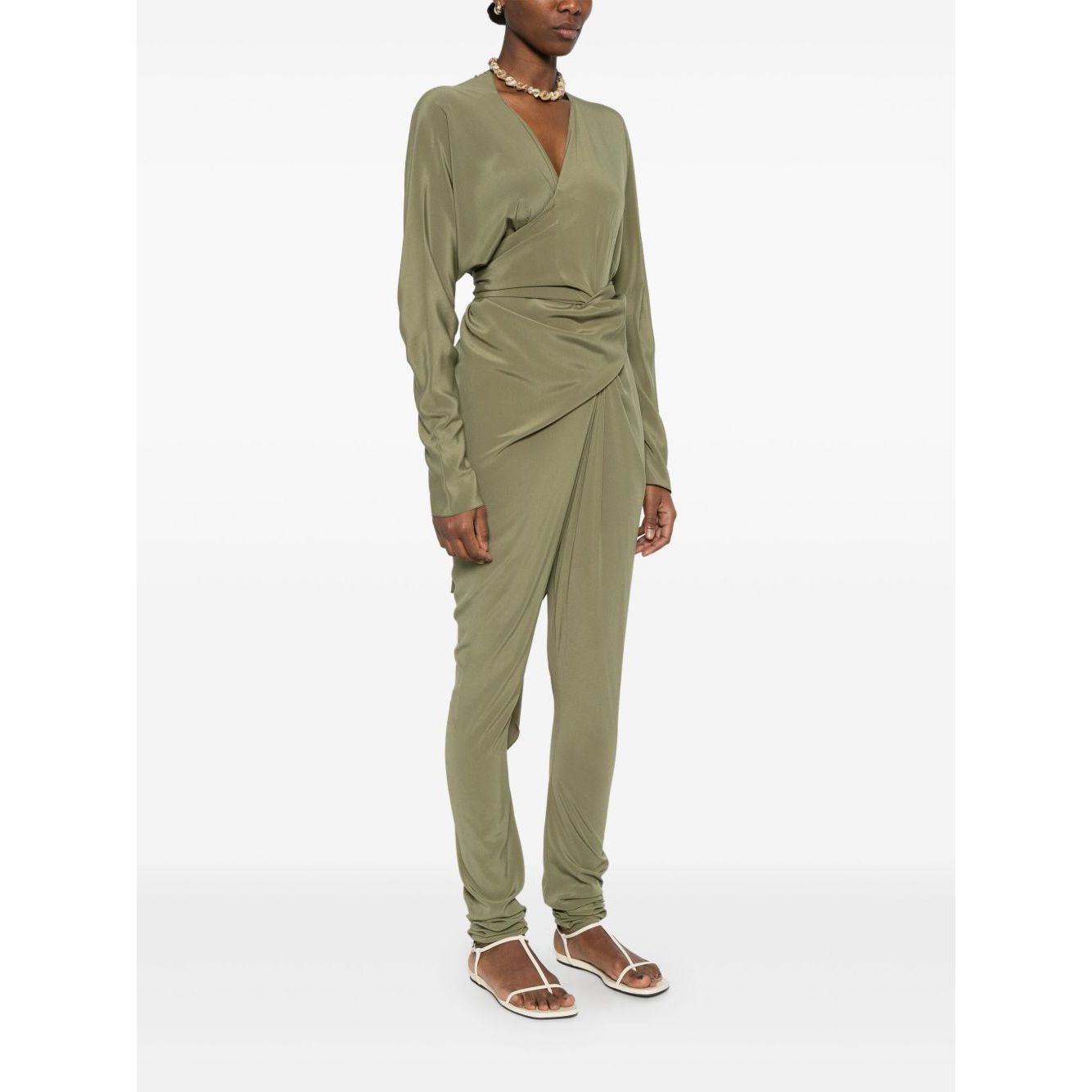 Woman wearing Cortana Cortana Serp Silk Jumpsuit in olive green with tied waist and draped design