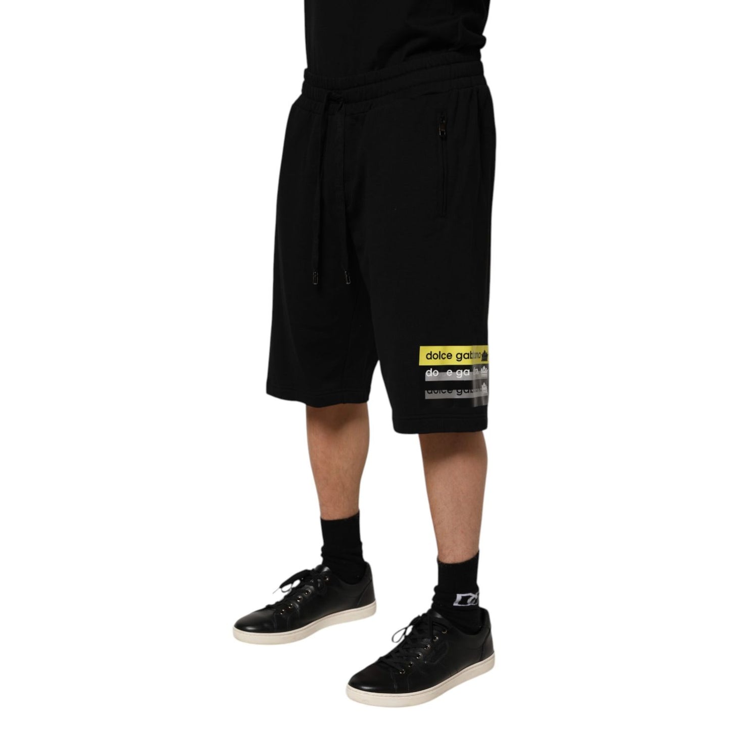 Dolce & Gabbana Black Cotton Mid Waist Casual Bermuda Short displayed on model, featuring logo details and drawstring closure.