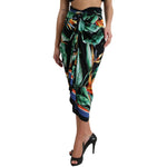 Woman wearing Dolce & Gabbana Black Strelitzia High Waist Wrap Midi Skirt with floral pattern and high heels.