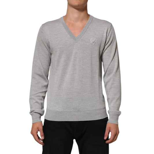 Dolce & Gabbana Gray Wool Knit Logo V-Neck Pullover Sweater on a model with classic design and luxurious fabric.