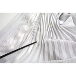 Close-up of Dolce & Gabbana Light Grey Polyester Pleated Long Maxi Dress fabric with minor stain detail.