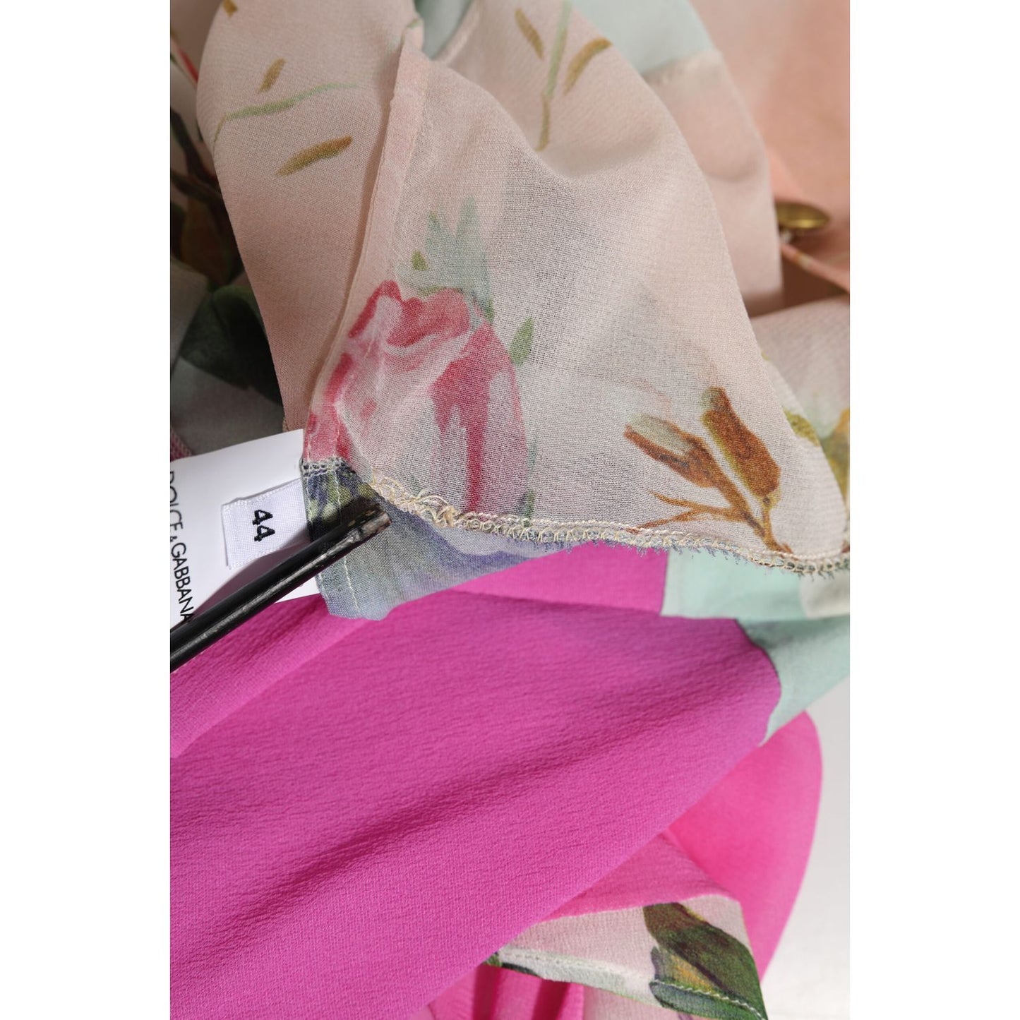 Close-up of Dolce & Gabbana Multicolor Floral Patchwork Silk Ascot Collar Top fabric and label.