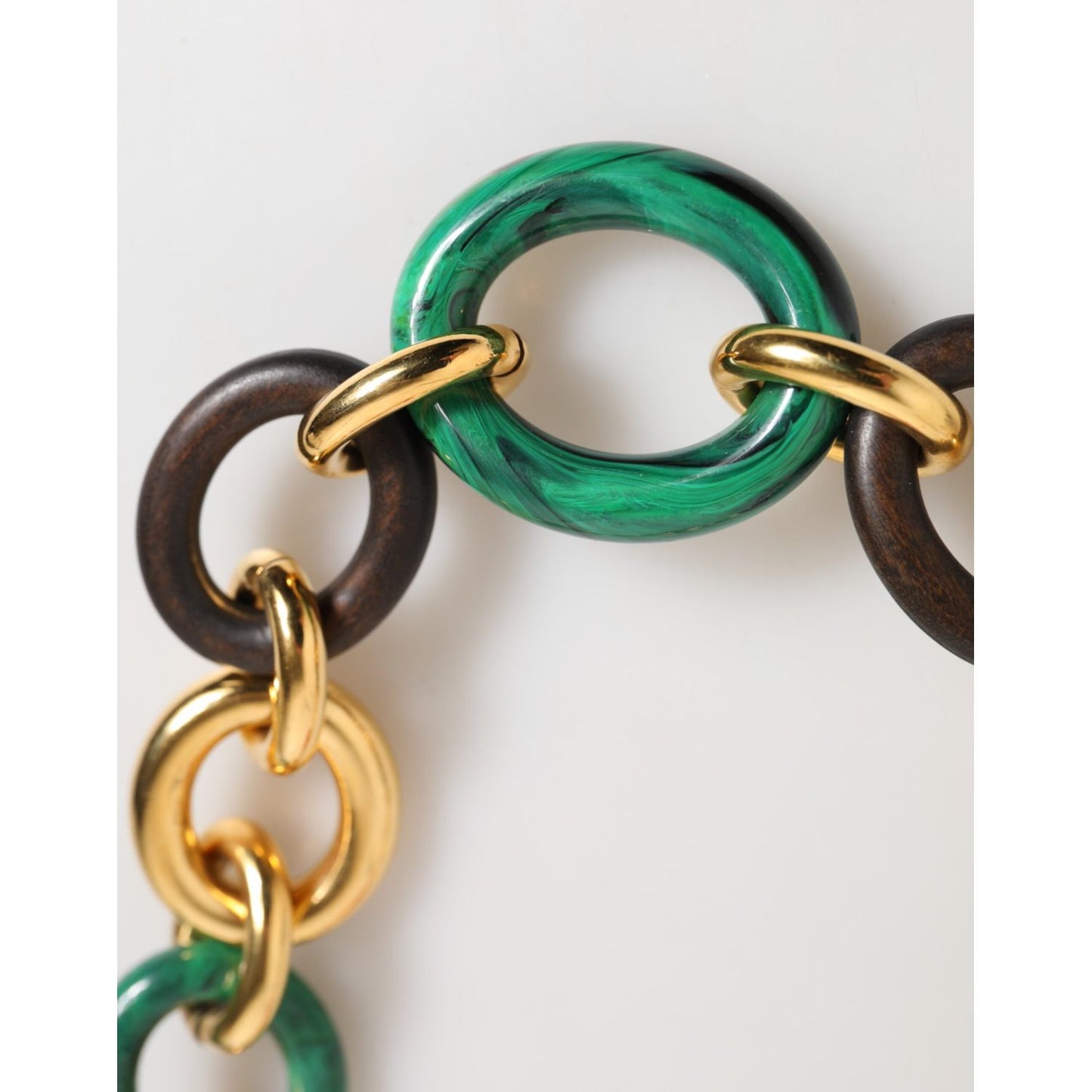 Close-up of Dolce & Gabbana Multicolor Gold Brass Tiger Lily Floral Chai Necklace showcasing green resin and gold-tone chains.