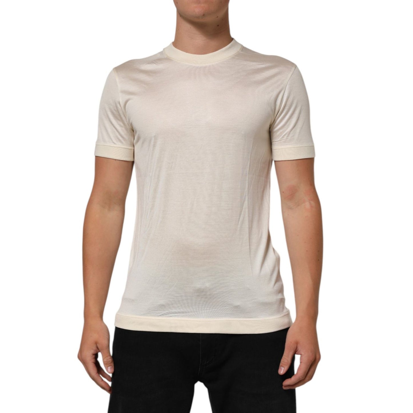 Dolce & Gabbana Off White Silk Crew Neck Short Sleeve T-shirt worn by a model, showcasing luxury Italian craftsmanship and elegant design.