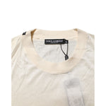 Dolce & Gabbana Off White Silk Crew Neck Short Sleeve T-shirt close-up view showing label and neckline details.