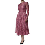 Dolce & Gabbana Pink Floral Lace Long Sleeve Midi Dress in pink lace with long sleeves, shown on a mannequin; elegant Italian fashion.