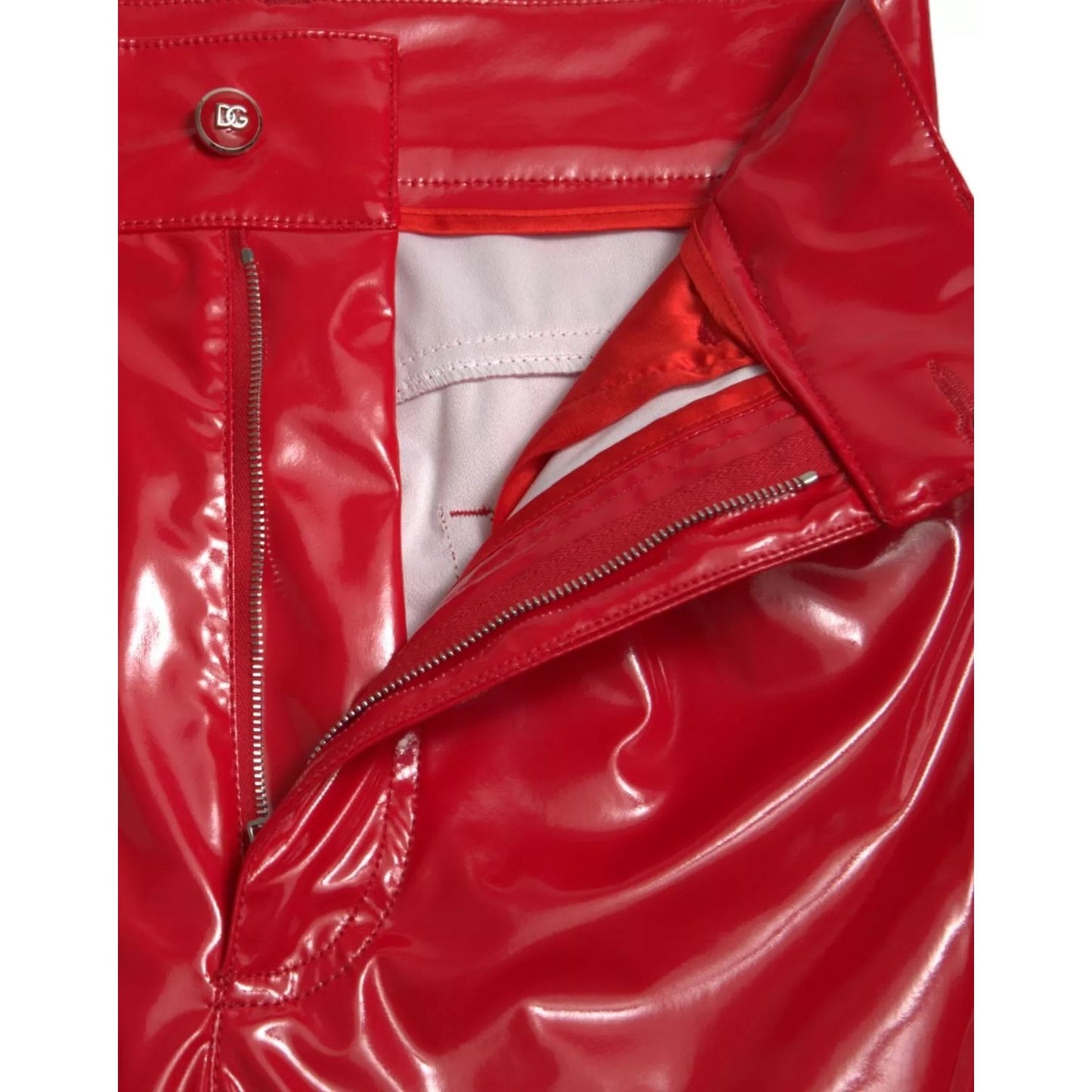 Close-up of Dolce & Gabbana Red High Waist Skinny Trouser Shiny Pants with zipper and logo detail, showcasing sleek polyester material.