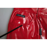 Dolce & Gabbana Red High Waist Skinny Trouser Shiny Pants close-up, featuring zipper closure and logo details, made from polyester.