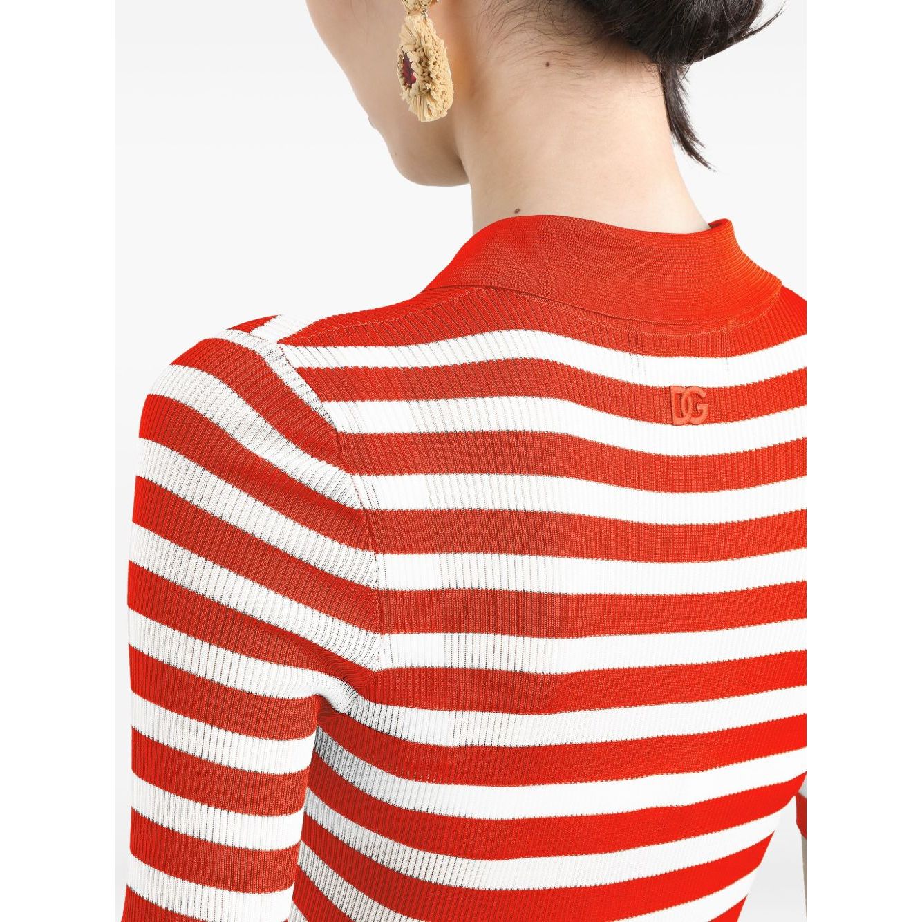 Back view of Dolce & Gabbana Striped Polo Top in orange and white with logo plaque, featuring ribbed texture.