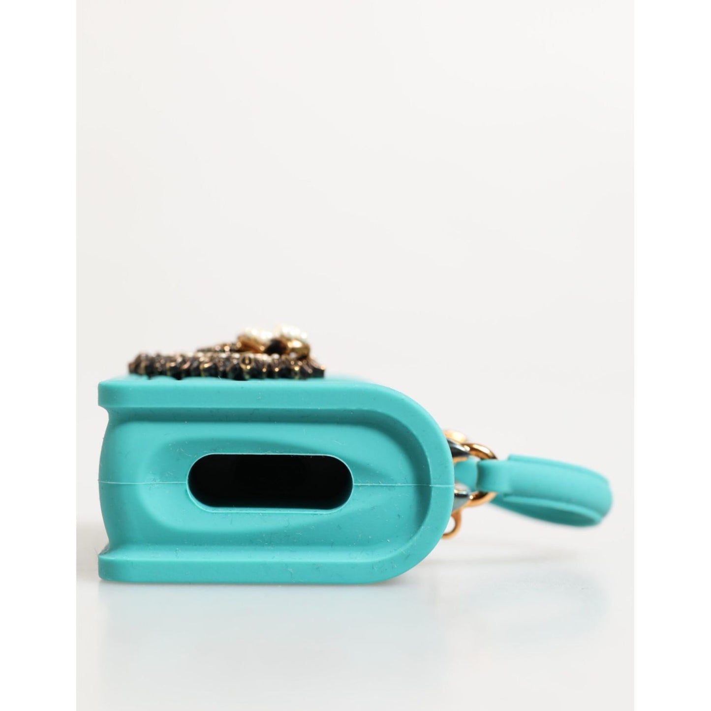 Side view of Dolce & Gabbana Turquoise Silicone Devotion Heart Cover Bag Airpods Case with quilted effect and gold accents.