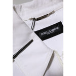 Close-up of Dolce & Gabbana White Barcode Patch Utility Zip Jumpsuit Pants label, showcasing luxury cotton fabric and sleek design.