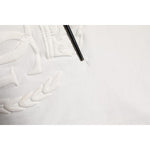 Close-up of Dolce & Gabbana White Cotton DG Crown Embossed Men T-shirt showing fixed hole in fabric