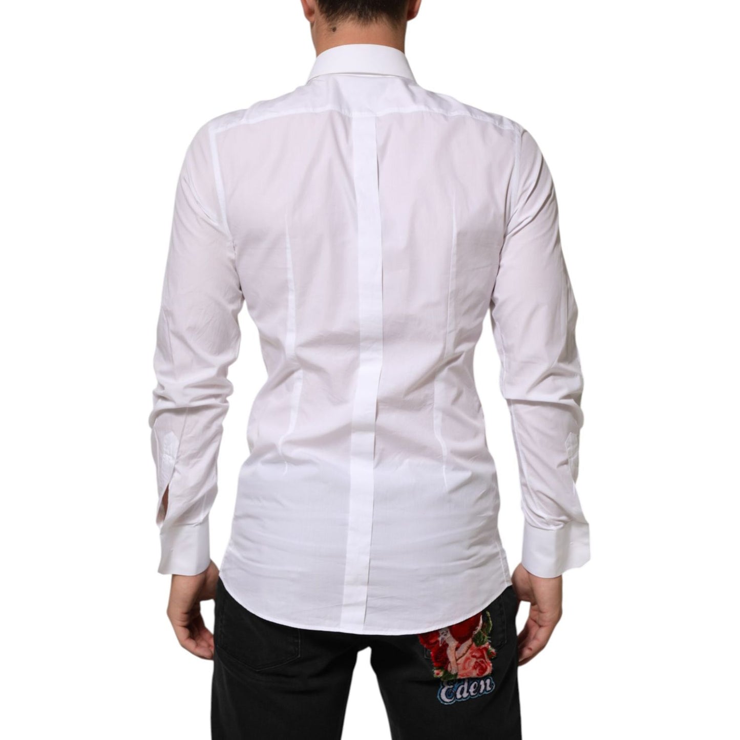Back view of a Dolce & Gabbana White Cotton GOLD DGPatch Formal Dress Shirt on a model, showcasing the long sleeves and tailored fit.