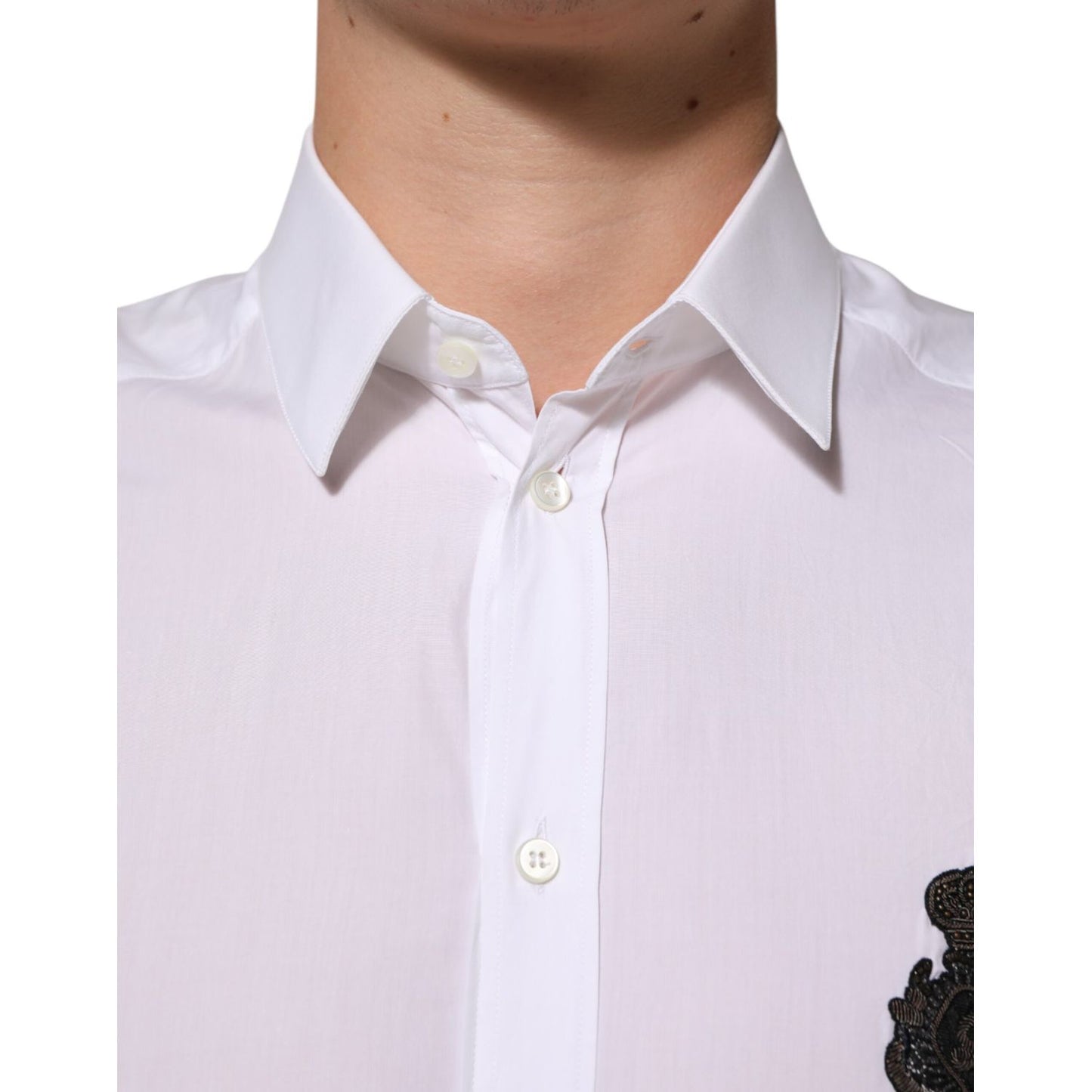 Close-up of Dolce & Gabbana White Cotton GOLD DGPatch Formal Dress Shirt with collared design and logo patch detail.