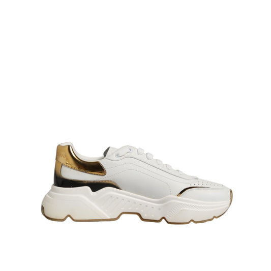 Dolce & Gabbana White Gold Daymaster Low Top Sneakers Shoes featuring white leather and gold accents, showcasing a chunky silhouette.