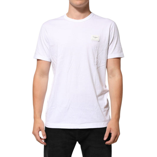 Male model wearing Dolce & Gabbana White Logo Plaque Cotton Crew Neck T-shirt with minor logo discolorations, shown in a regular fit.