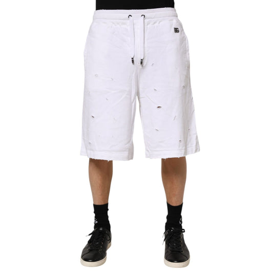 Dolce & Gabbana White Ripped Mid Waist Casual Bermuda Short on model, showcasing trendy ripped details, ideal for summer fashion.
