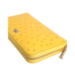 Dolce & Gabbana Yellow Leather Logo Plaque Zip Around Continental Wallet with zipper fastening and logo engraved metal hardware in yellow.