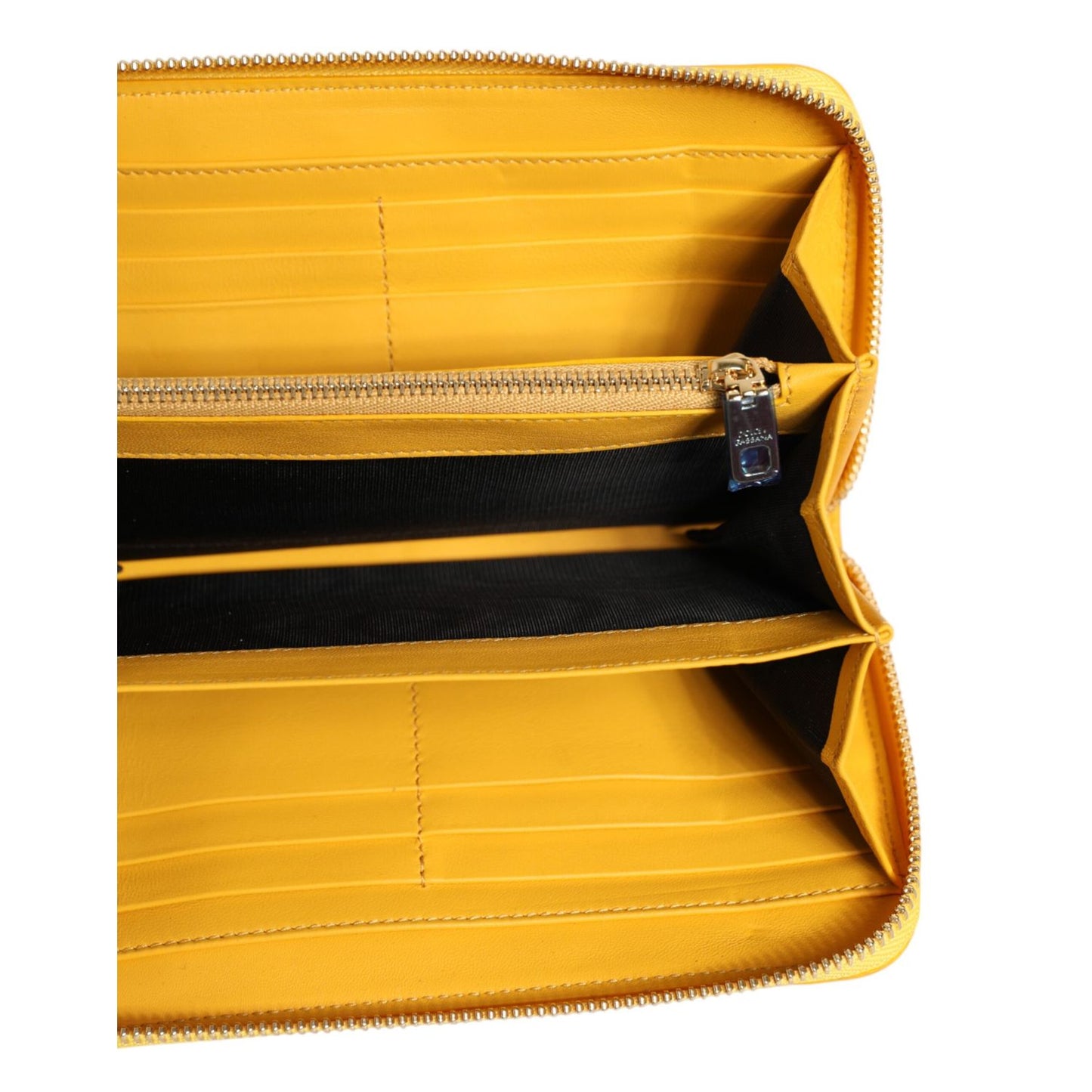Open view of Dolce & Gabbana Yellow Leather Logo Plaque Zip Around Continental Wallet showing internal compartments.