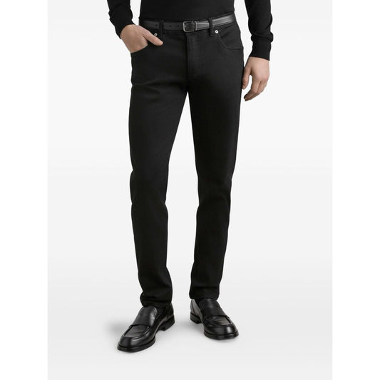Dolce & Gabbana five pockets logo plaque Denim cotton jeans in black, featuring front button fastening and belt loops.