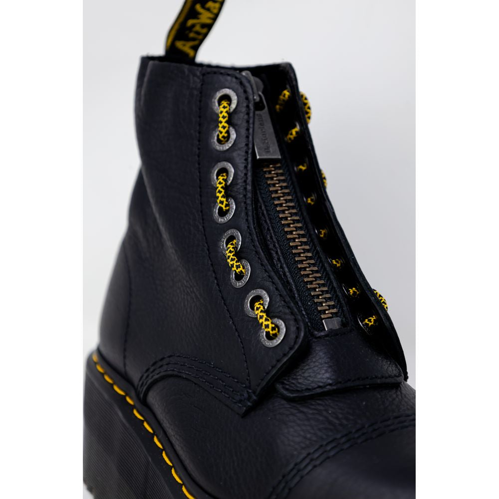 Dr. Martens Black Leather Boot with lace-up design and sturdy rubber sole, close-up view